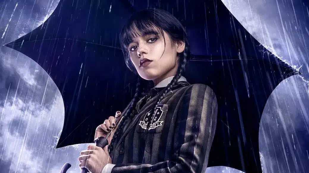 Alt text (in Italian):Mercoledì sotto la pioggia nella serie record di Tim Burton su Netflix