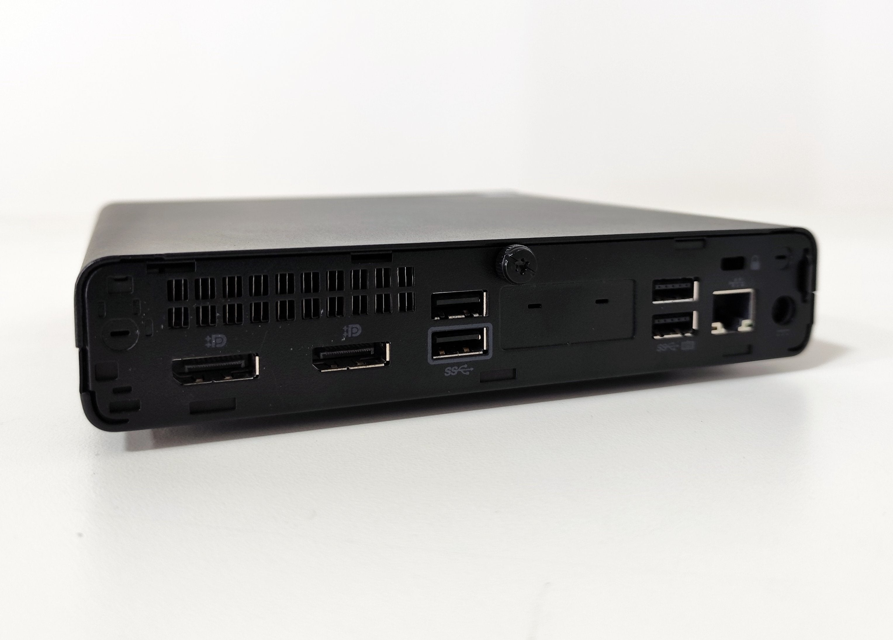Back view of a black mini desktop PC with multiple USB ports, DisplayPorts, and Ethernet, Messoanuovo.it